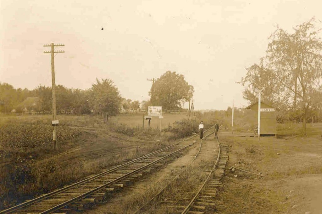 Men-walk-railroad-tracks
